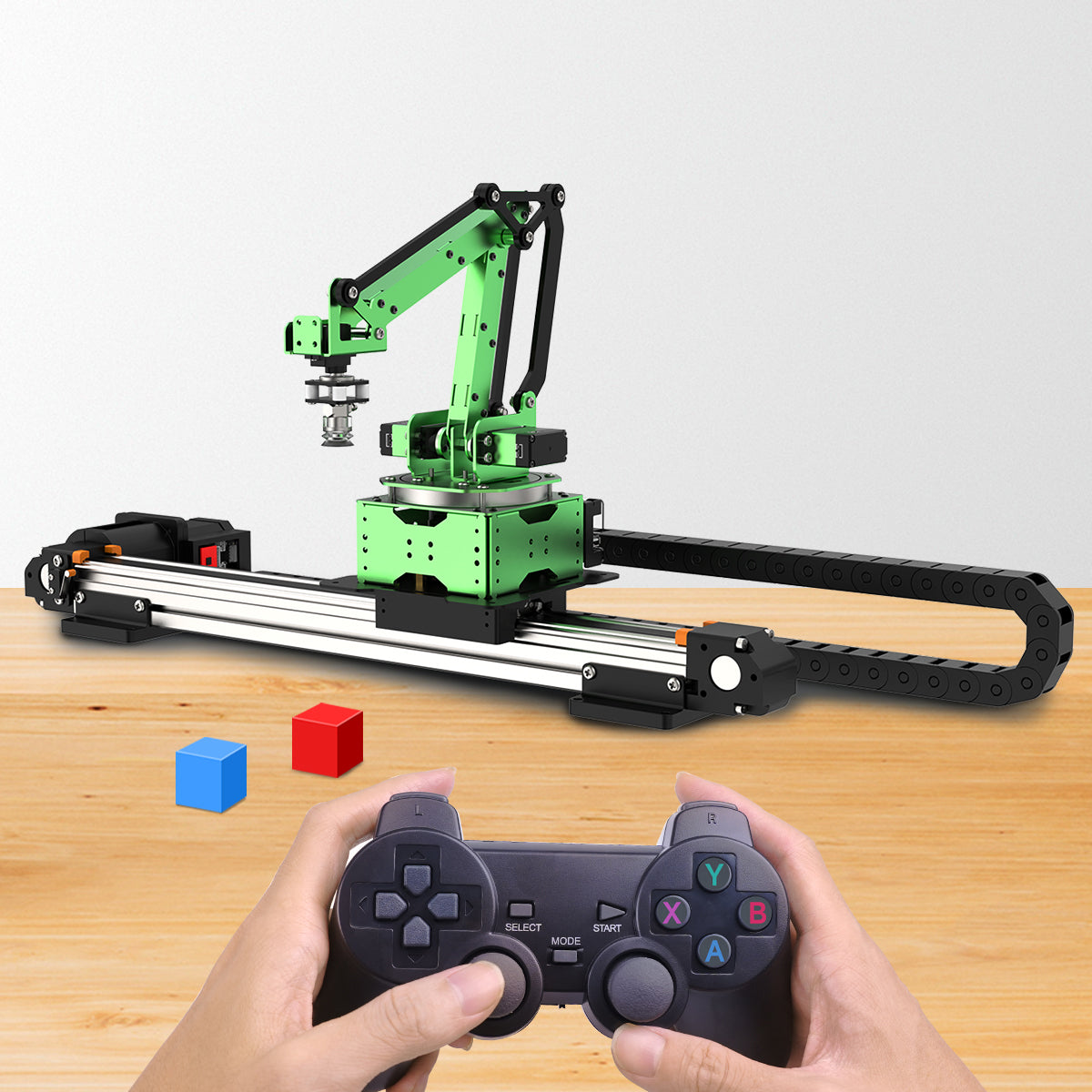 Robotic arm setup with remote control on a wooden surface